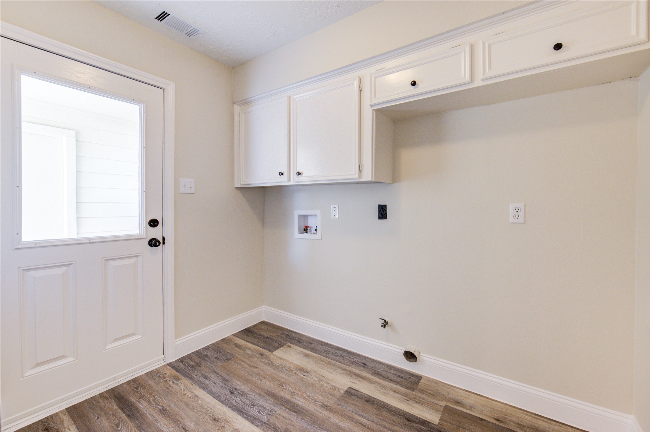 9115 Taidswood Drive Spring, TX 77379 - Photo 18 of 41 In-house laundry room has gas and electric connections, plenty of room to add a second refrigerator/freezer. There are also overhead storage cabinets for your laundry items.