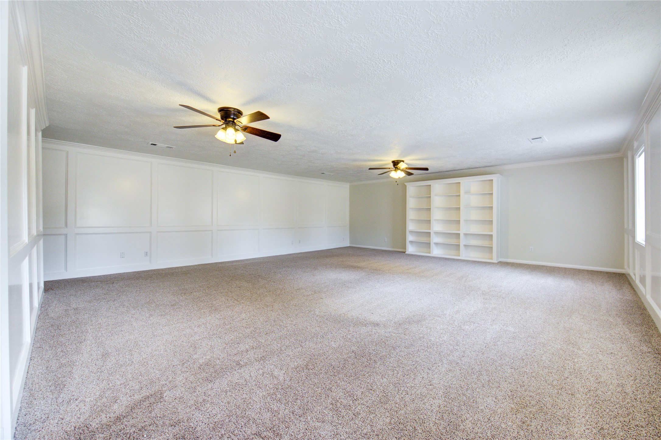 9115 Taidswood Drive Spring, TX 77379 - Photo 32 of 41 This enormous game room has built-in shelving, two lighted ceiling fans, clean, easy-care carpeting and window blinds. It's a great place to just "hang out"!