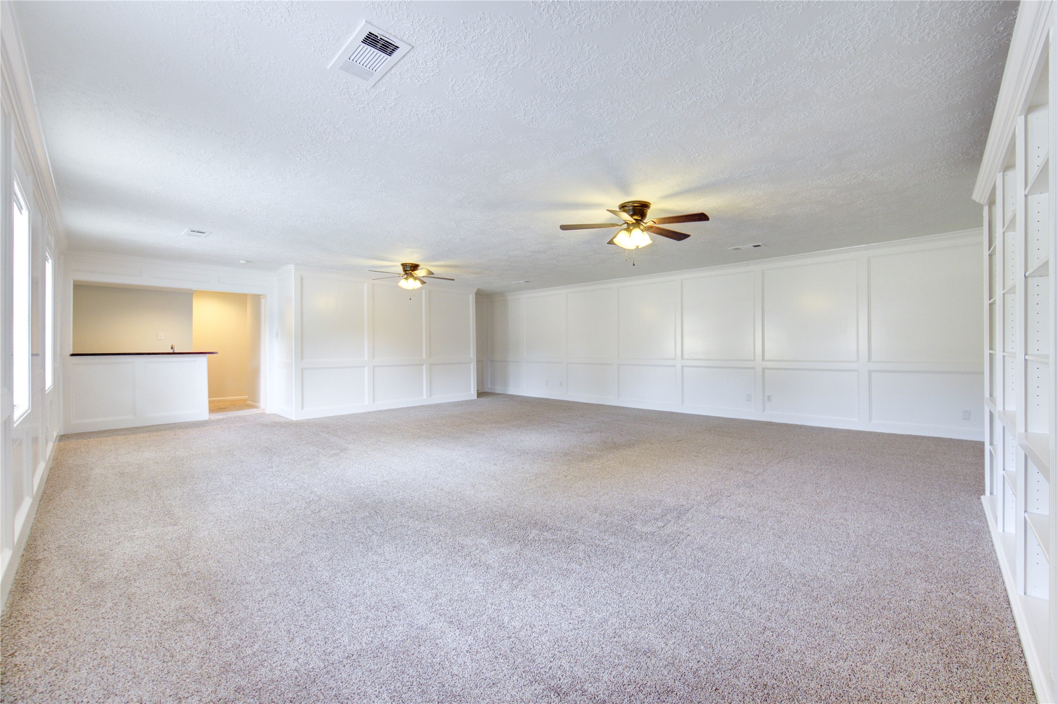 9115 Taidswood Drive Spring, TX 77379 - Photo 33 of 41 The game room has a staircase leading down to the 3-car garage.