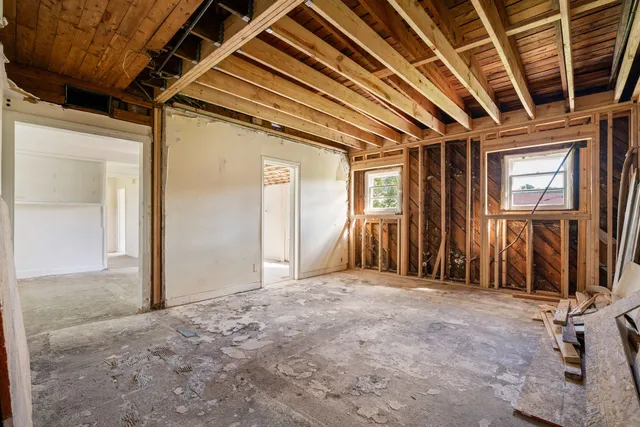 a view of an empty room with a balcony