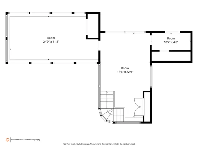 an empty room with large windows
