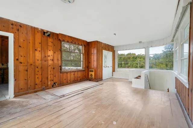 a view of an empty room with a large window