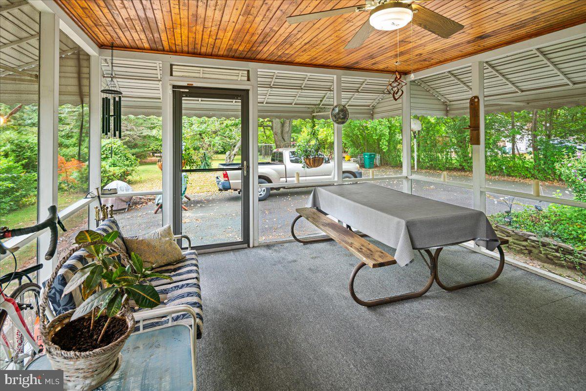 2337 Pennington Road Pennington, NJ 08534 - Photo 23 of 27 a backyard of a house with barbeque oven table and chairs