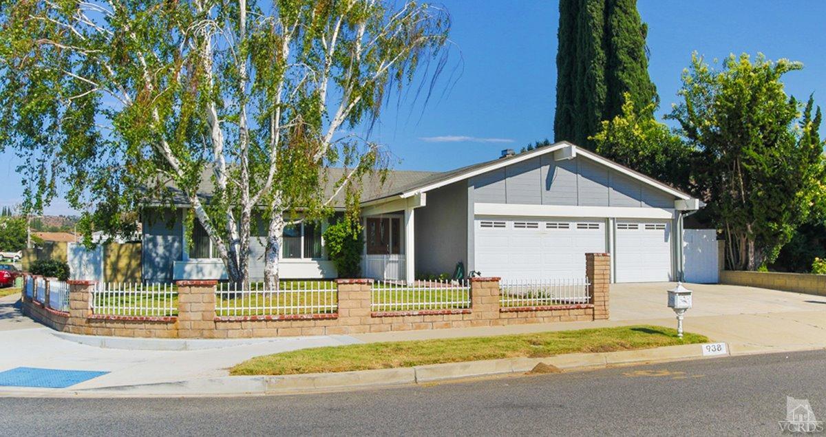 938 Erringer Road Simi Valley, CA 93065 - Photo 2 of 28 a view of a house with palm trees and a big yard