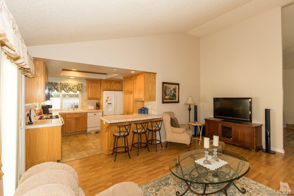 938 Erringer Road Simi Valley, CA 93065 - Photo 12 of 28 a living room with furniture and a flat screen tv