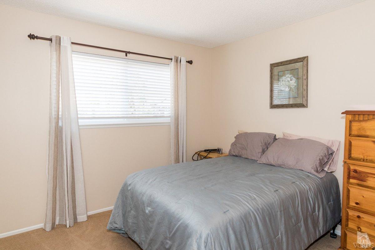 938 Erringer Road Simi Valley, CA 93065 - Photo 17 of 28 a bedroom with a bed and a window