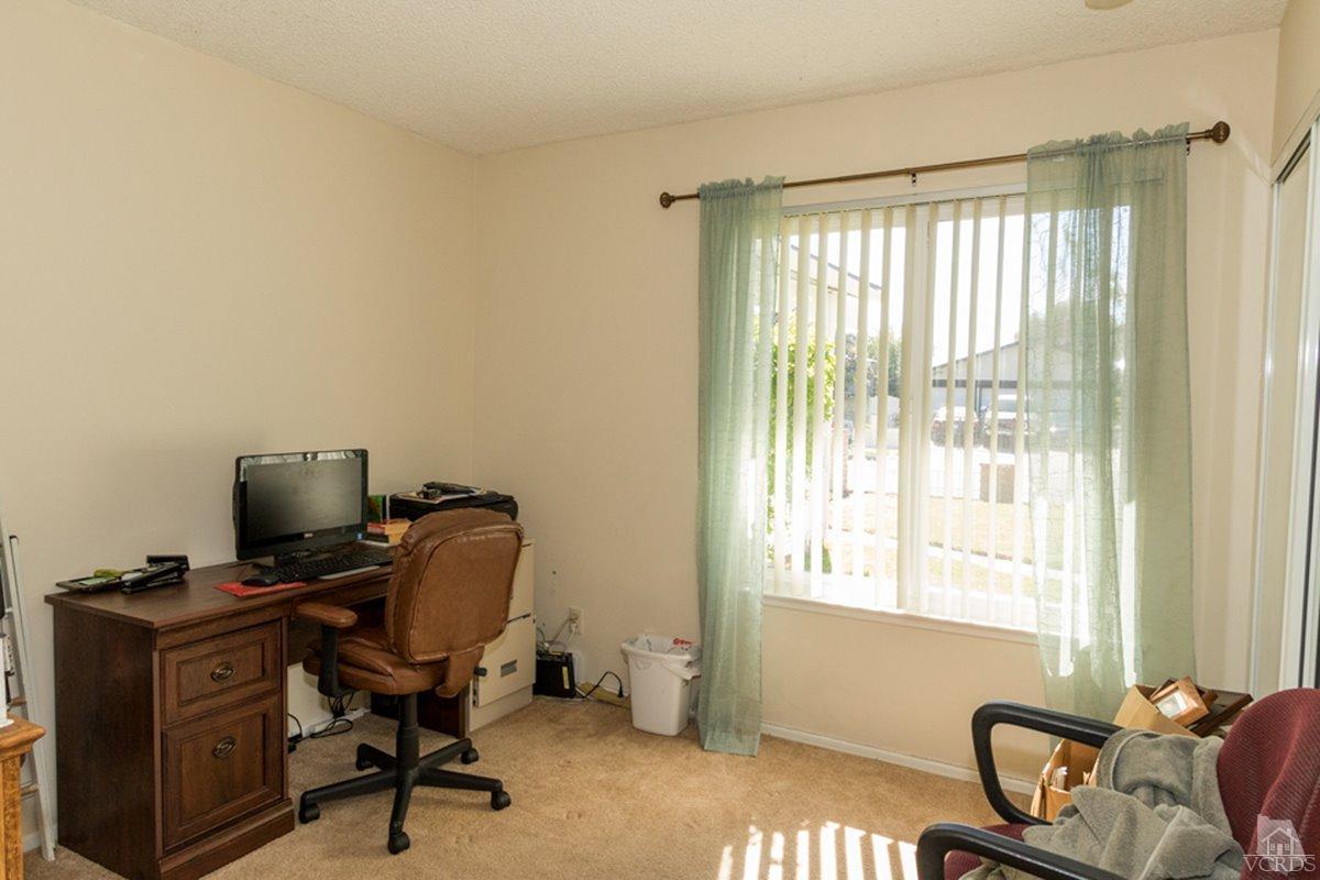 938 Erringer Road Simi Valley, CA 93065 - Photo 19 of 28 a view of a workspace with furniture and a window