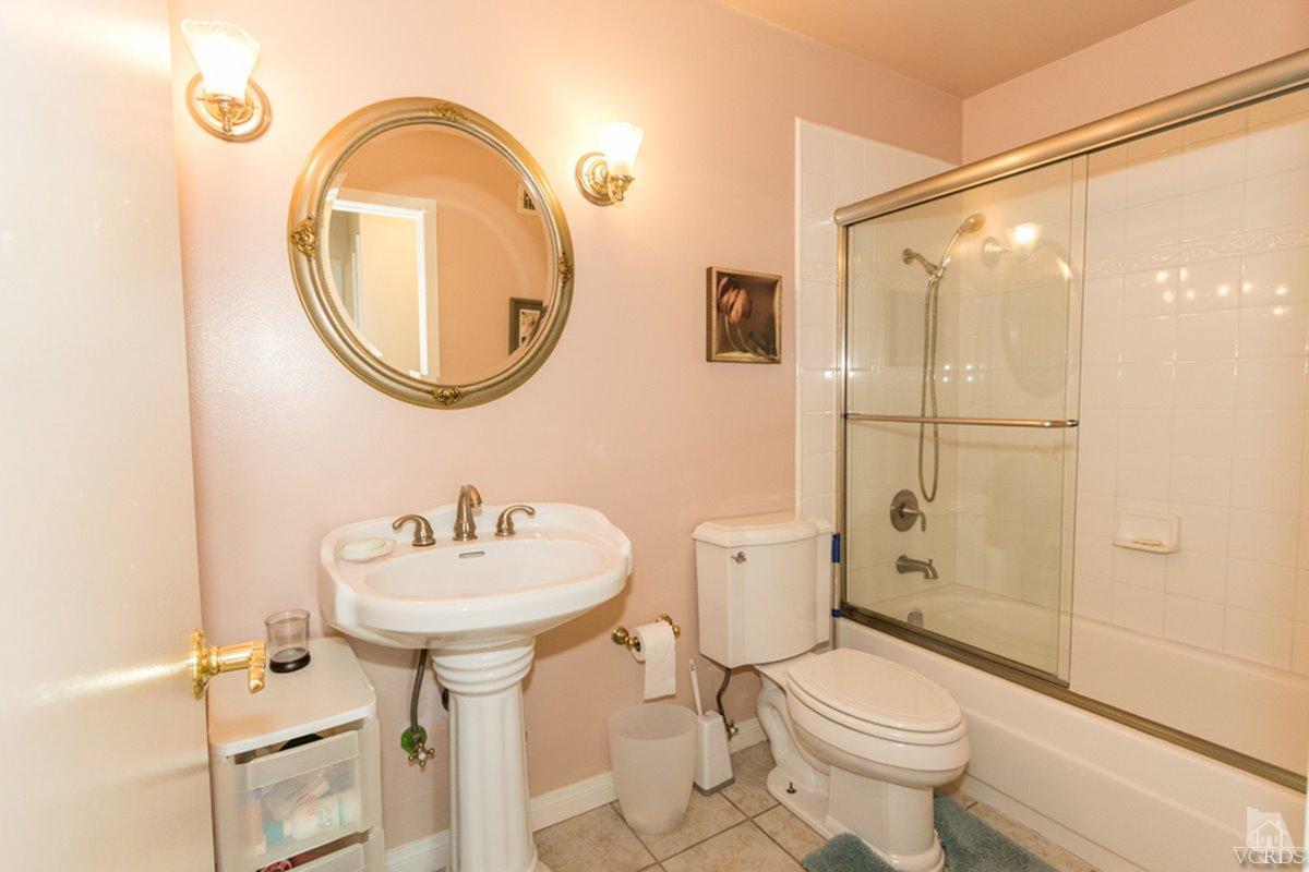 938 Erringer Road Simi Valley, CA 93065 - Photo 20 of 28 a bathroom with a sink toilet and a mirror