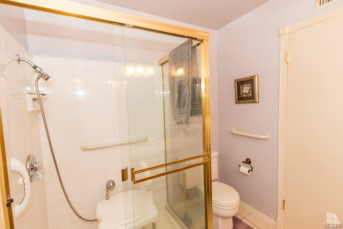 938 Erringer Road Simi Valley, CA 93065 - Photo 25 of 28 a bathroom with a granite countertop shower sink vanity and toilet