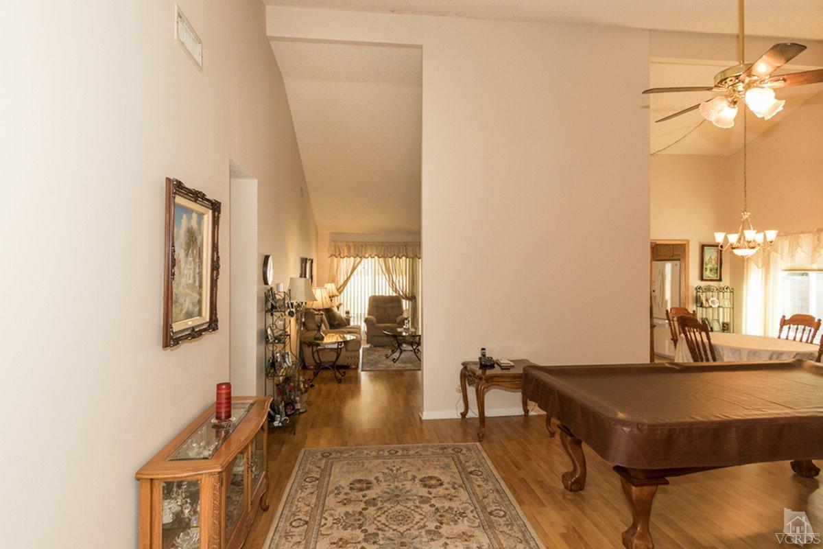 938 Erringer Road Simi Valley, CA 93065 - Photo 4 of 28 a living room with a table chairs and a potted plant