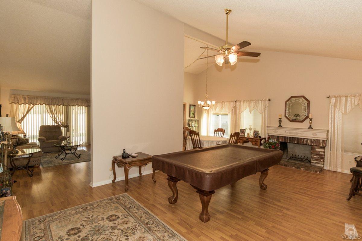 938 Erringer Road Simi Valley, CA 93065 - Photo 6 of 28 a living room with dining table and a wooden floor