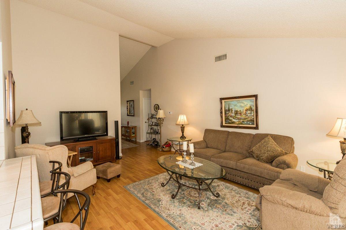 938 Erringer Road Simi Valley, CA 93065 - Photo 9 of 28 a living room with furniture and a flat screen tv