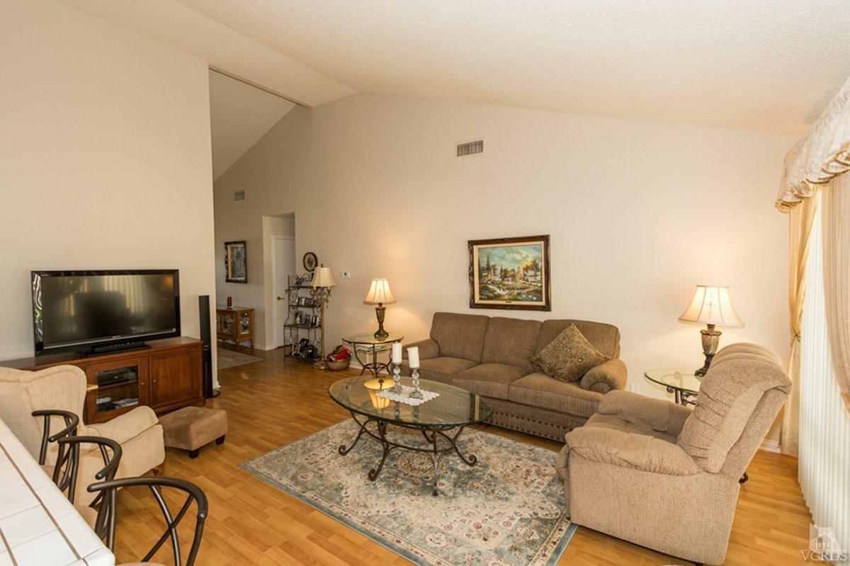 938 Erringer Road Simi Valley, CA 93065 - Photo 10 of 28 a living room with furniture and a flat screen tv
