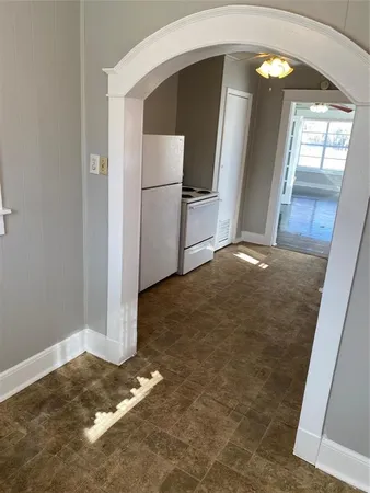 a view of kitchen with stainless steel appliances granite countertop cabinets and a stove top oven