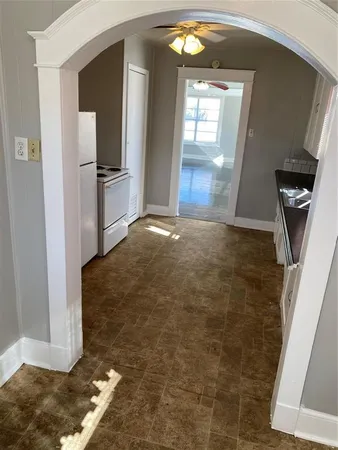 a kitchen with granite countertop a sink and a stove