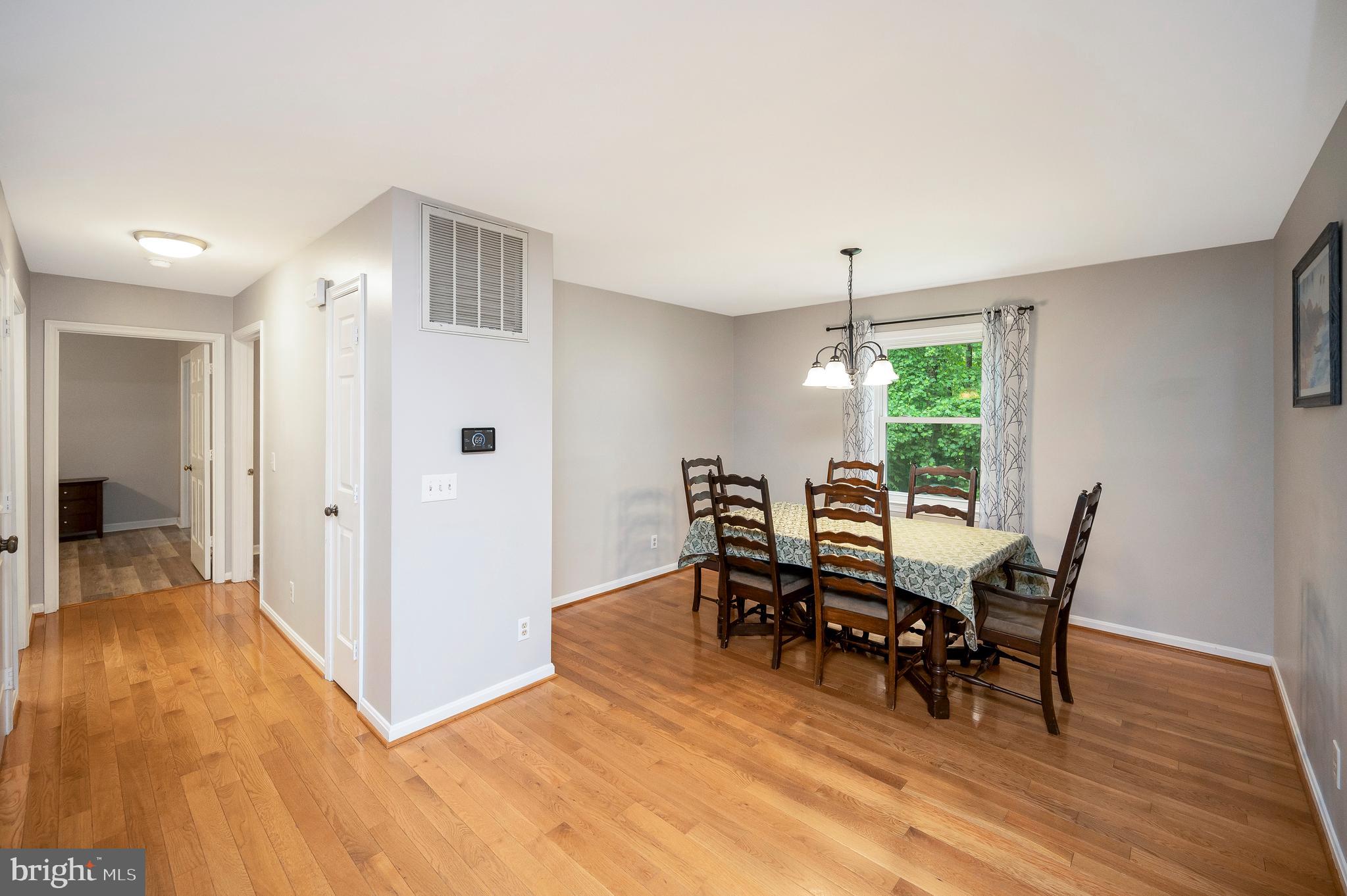 679 Cropp Road Fredericksburg, VA 22406 - Photo 13 of 39 a view of a dining room with furniture window and wooden floor