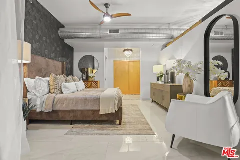 a bed room with furniture and a fireplace