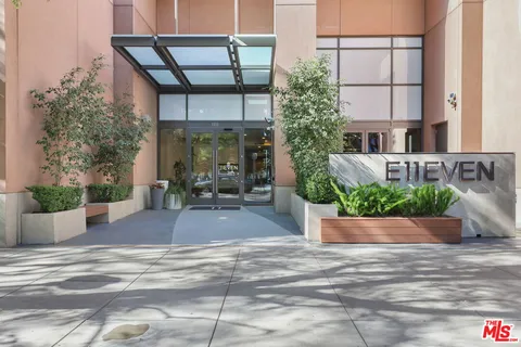 a front view of a building with potted plants