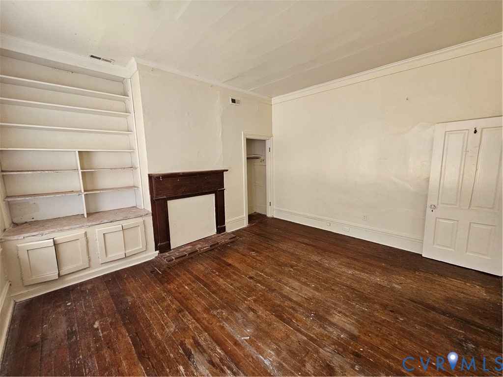 9330 Halls Run Road Chesterfield, VA 23832 - Photo 7 of 11 Unfurnished living room with built in shelves, dar