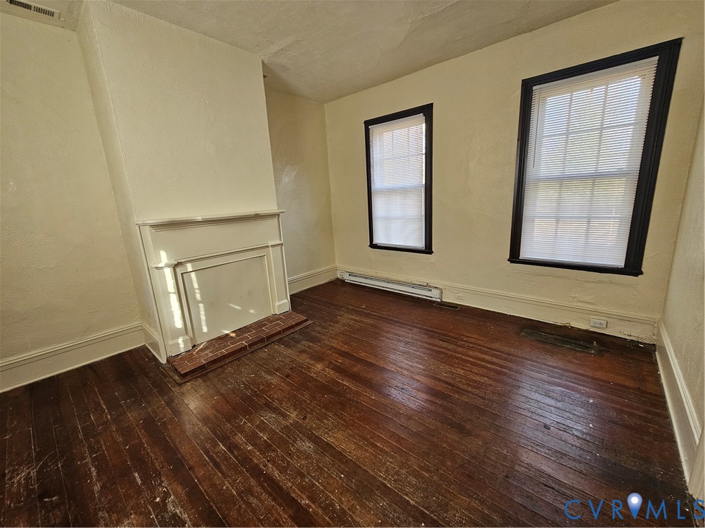 9330 Halls Run Road Chesterfield, VA 23832 - Photo 8 of 11 Unfurnished living room featuring dark wood-style