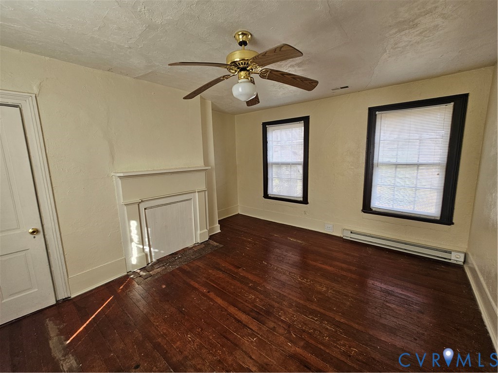 9330 Halls Run Road Chesterfield, VA 23832 - Photo 10 of 11 Unfurnished living room featuring a baseboard heat