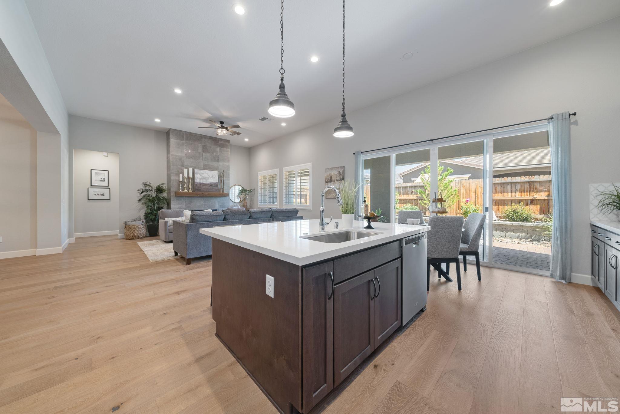 2450 Buttermere Court Reno, NV 89521 - Photo 12 of 39 a kitchen with a stove kitchen island furniture and wooden floor