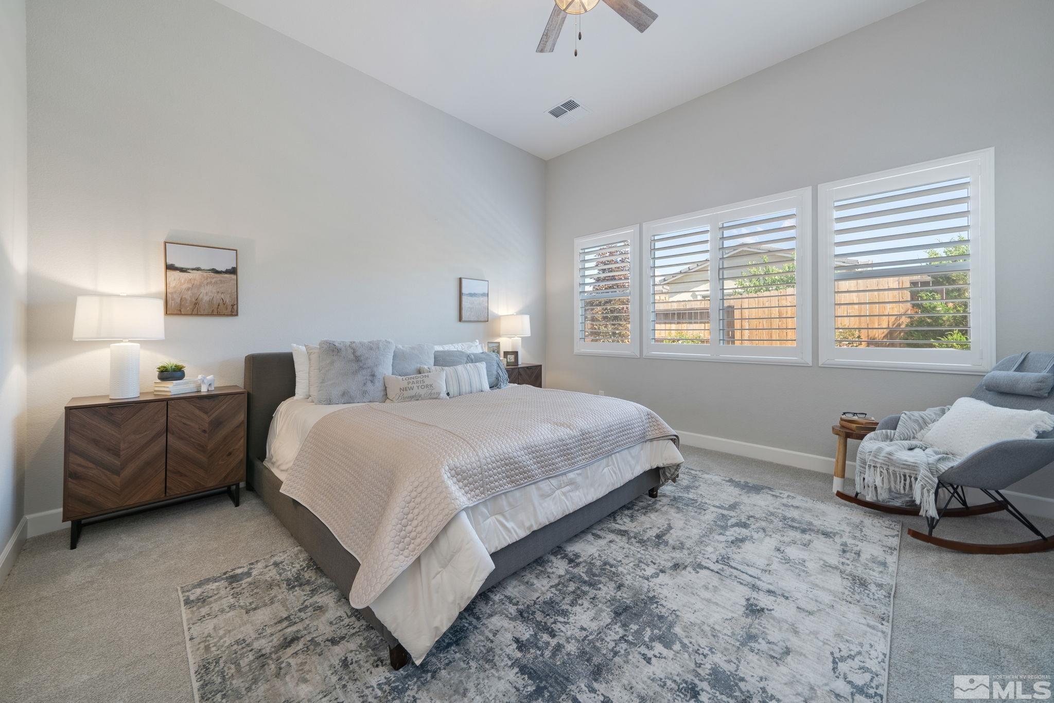 2450 Buttermere Court Reno, NV 89521 - Photo 15 of 39 a bedroom with a bed and a couch