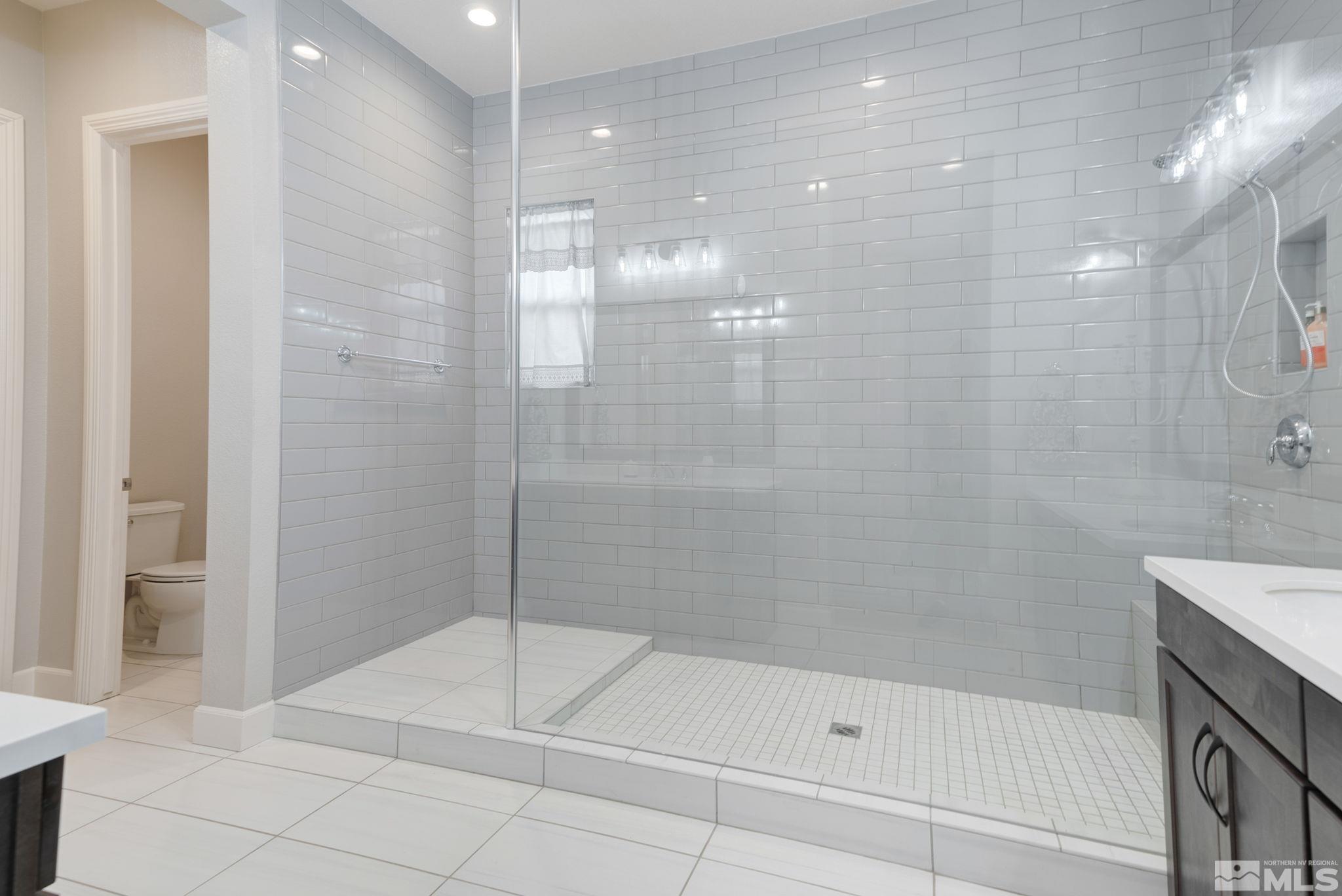 2450 Buttermere Court Reno, NV 89521 - Photo 17 of 39 a bathroom with a shower and a sink