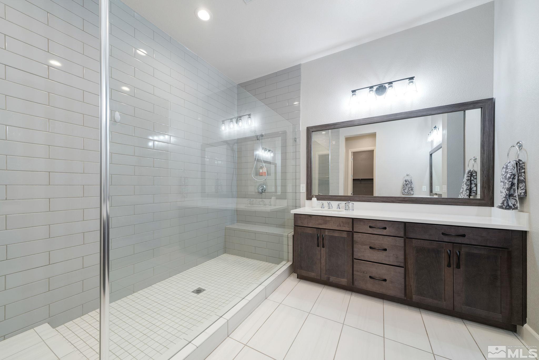 2450 Buttermere Court Reno, NV 89521 - Photo 18 of 39 a bathroom with a sink mirror and shower