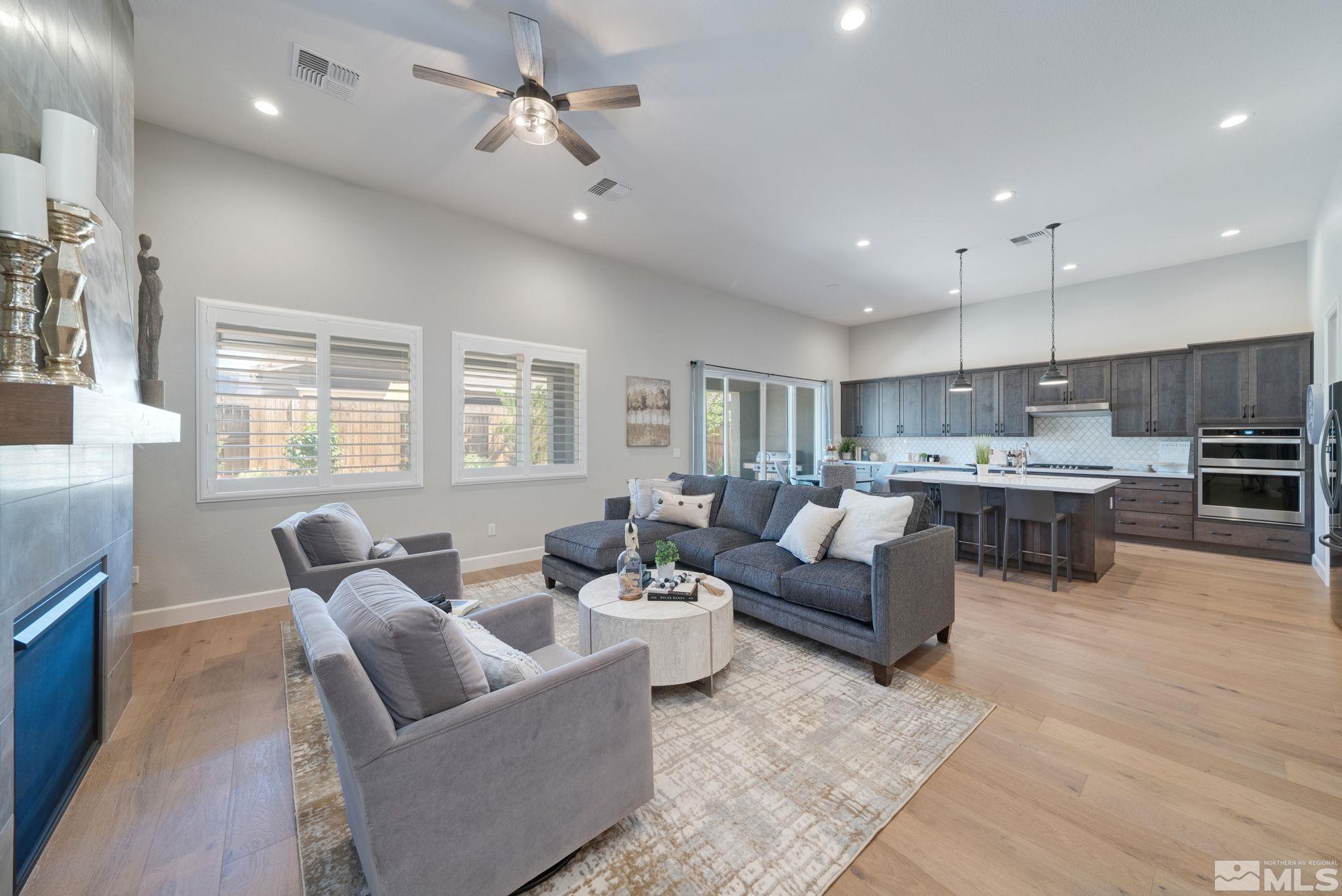 2450 Buttermere Court Reno, NV 89521 - Photo 6 of 39 a living room with furniture kitchen and a large window