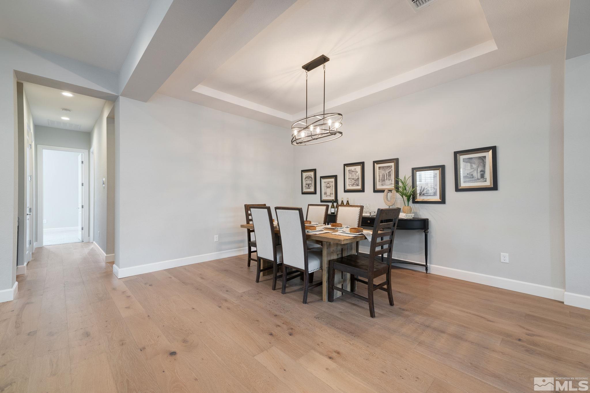 2450 Buttermere Court Reno, NV 89521 - Photo 8 of 39 a view of a dining room with furniture and chandelier