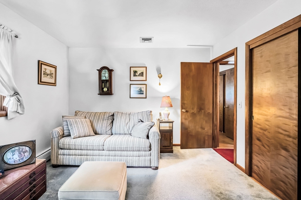 75 Fisher Road Chicopee, MA 01013 - Photo 17 of 25 a living room with furniture and a gate