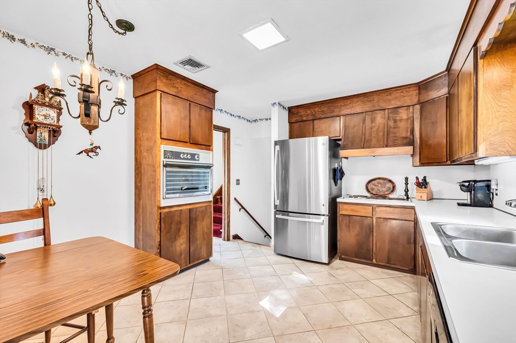 75 Fisher Road Chicopee, MA 01013 - Photo 8 of 25 a kitchen with stainless steel appliances granite countertop a refrigerator a stove top oven a sink and dishwasher