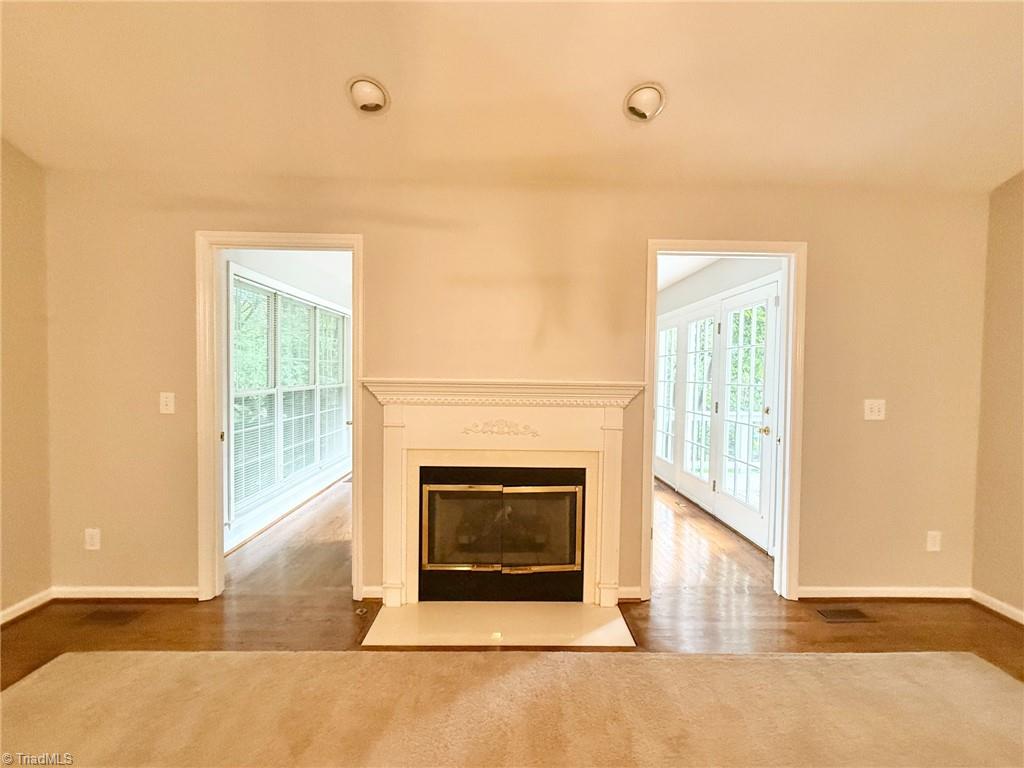 7500 Bartonshire Court Oak Ridge, NC 27310 - Photo 4 of 20 Great room with attached sunroom