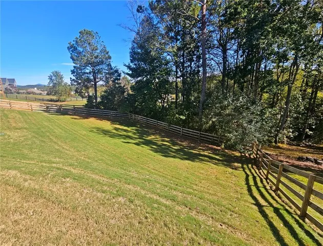 a view of a swimming pool with an outdoor space and seating area