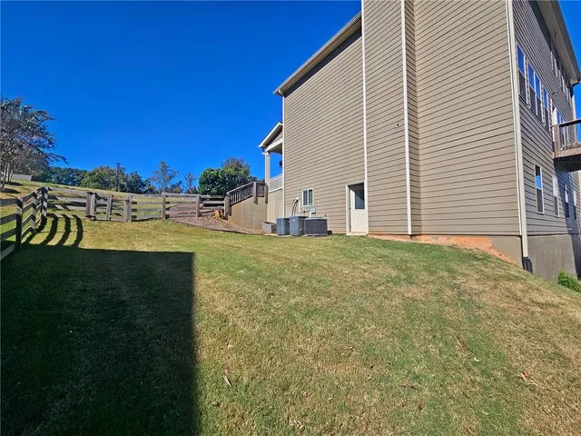 a view of a backyard of the house