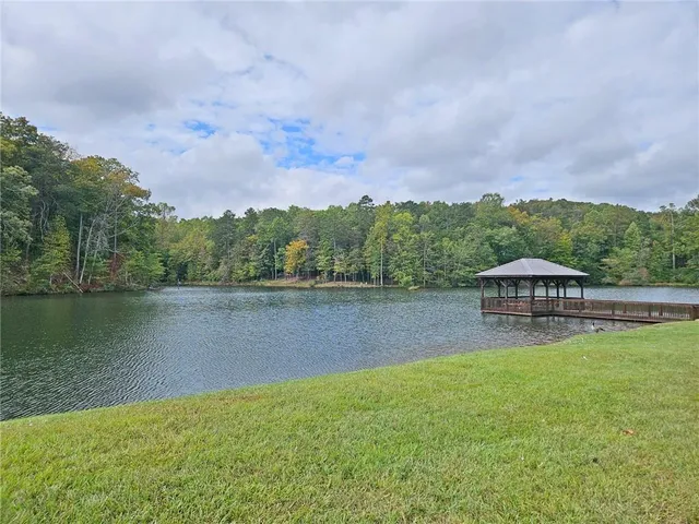 an aerial view of a house with a yard and a fountain