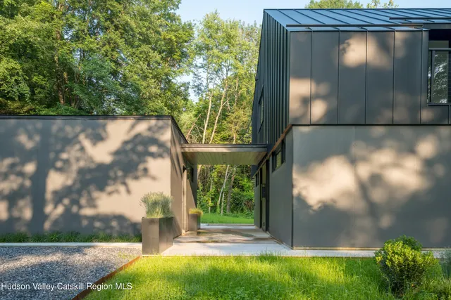 a view of a livingroom with furniture and a large window