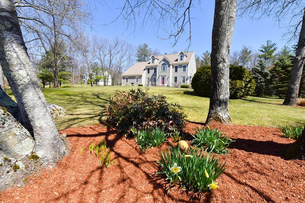 244 Hayden Road Groton, MA 01450 - Photo 2 of 23 a view of a yard with plants