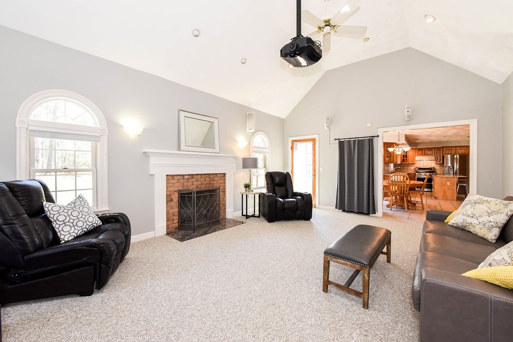 244 Hayden Road Groton, MA 01450 - Photo 7 of 23 a living room with furniture and a fireplace
