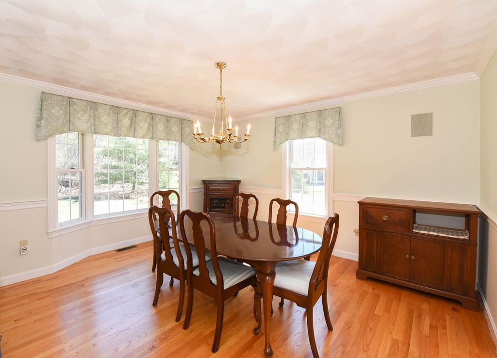 244 Hayden Road Groton, MA 01450 - Photo 8 of 23 a view of a dining room with furniture window and wooden floor