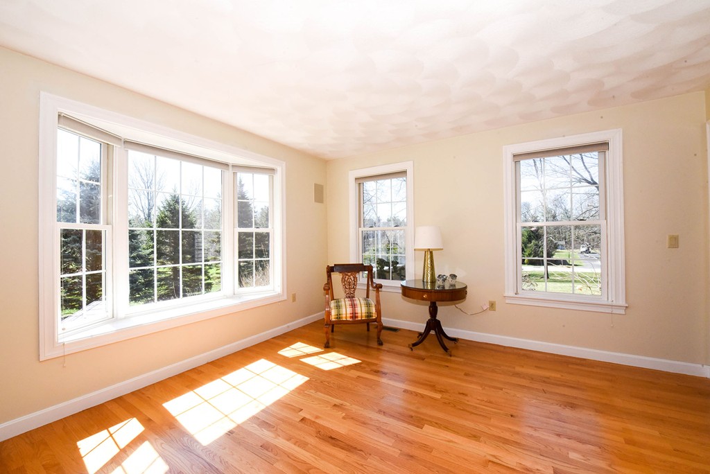 244 Hayden Road Groton, MA 01450 - Photo 9 of 23 wooden floor in an empty room with a window