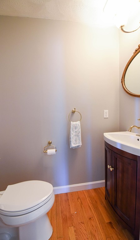 244 Hayden Road Groton, MA 01450 - Photo 10 of 23 a bathroom with a granite countertop toilet and a sink