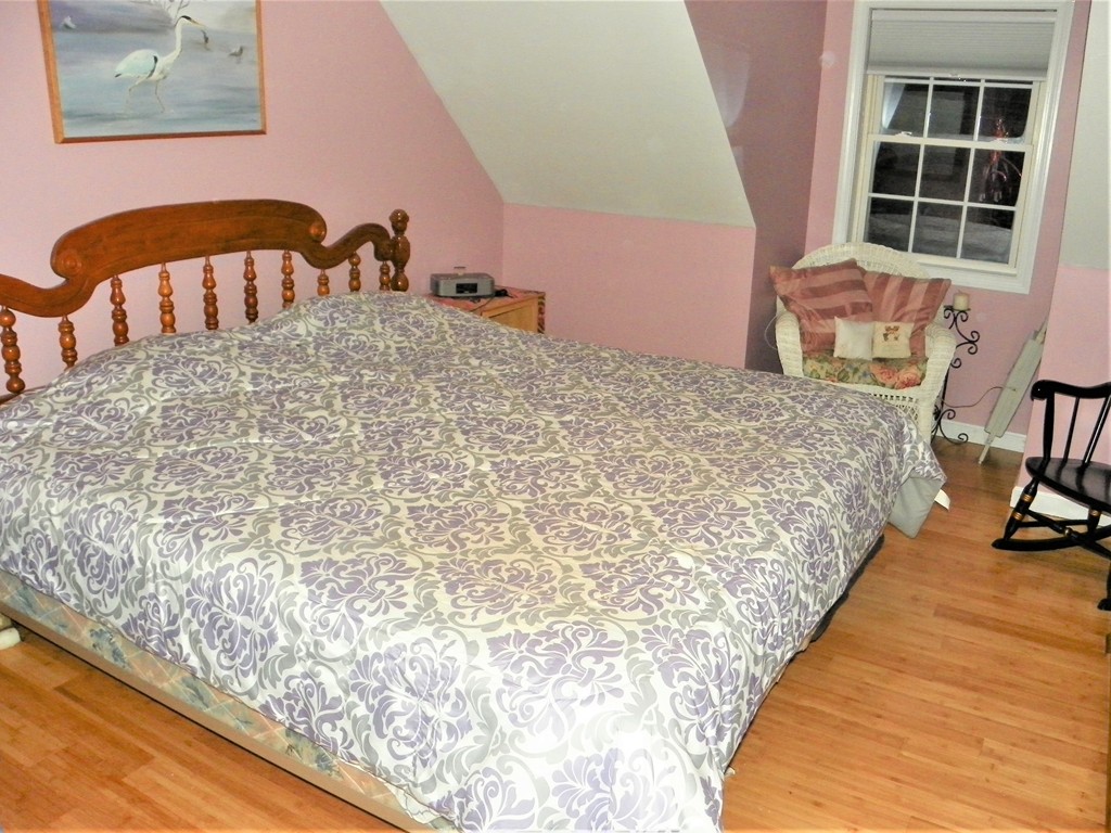 67 Gage Road Athol, MA 01331 - Photo 12 of 12 a large bed sitting in a bedroom next to a window