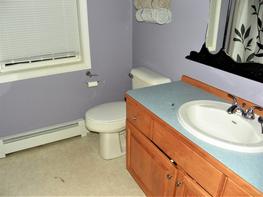67 Gage Road Athol, MA 01331 - Photo 8 of 12 a bathroom with a sink a toilet and mirror