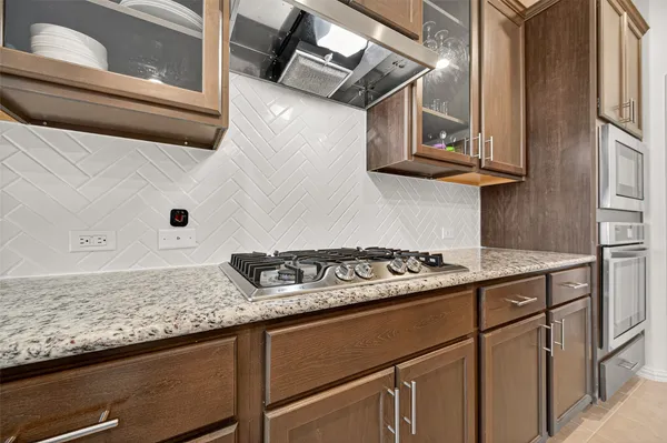 an aerial view of a swimming pool with outdoor seating