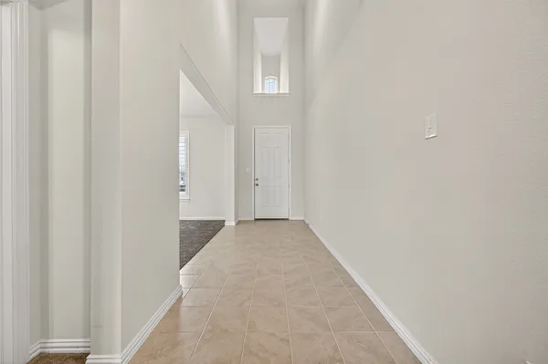 a view of a dining room with furniture and window