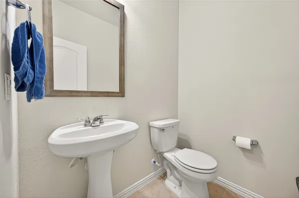 a view of a hallway with wooden floor and a window