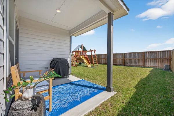 a bedroom with a bed and a desk
