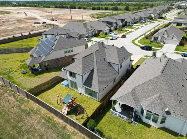 a view of a house with a backyard and a slide